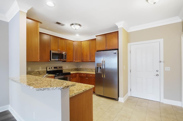 kitchen featuring kitchen peninsula, light stone counters, ornamental molding, and appliances with stainless steel finishes