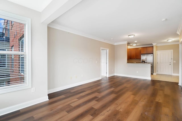 unfurnished living room with dark wood-type flooring and ornamental molding