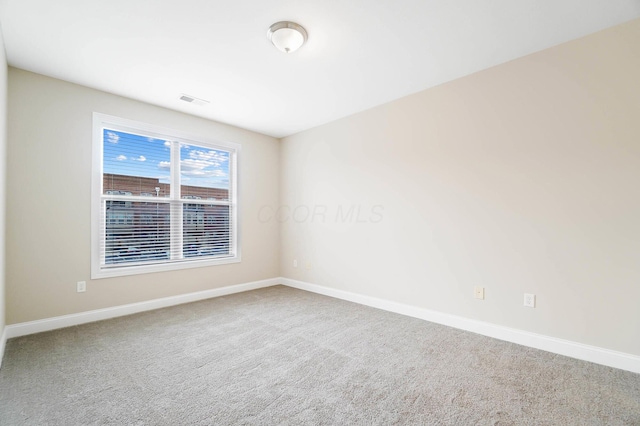 unfurnished room featuring carpet flooring