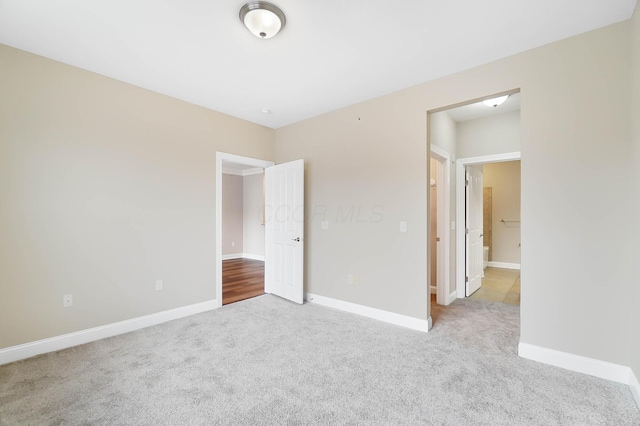 unfurnished bedroom with light carpet