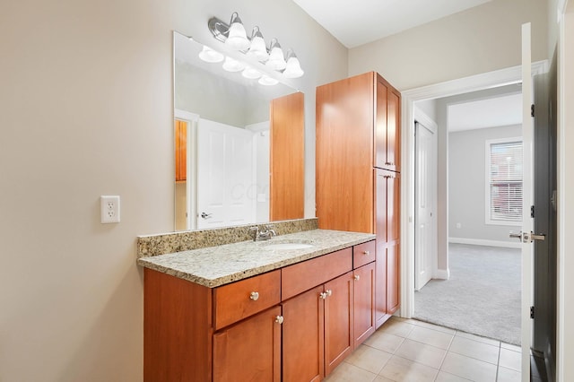 bathroom featuring tile patterned flooring and vanity