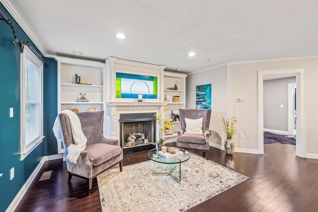 living area featuring dark wood-type flooring and ornamental molding