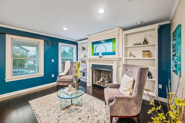 living area featuring dark hardwood / wood-style flooring and crown molding