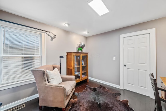 living area with dark hardwood / wood-style floors