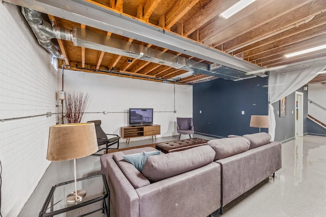 living room featuring brick wall