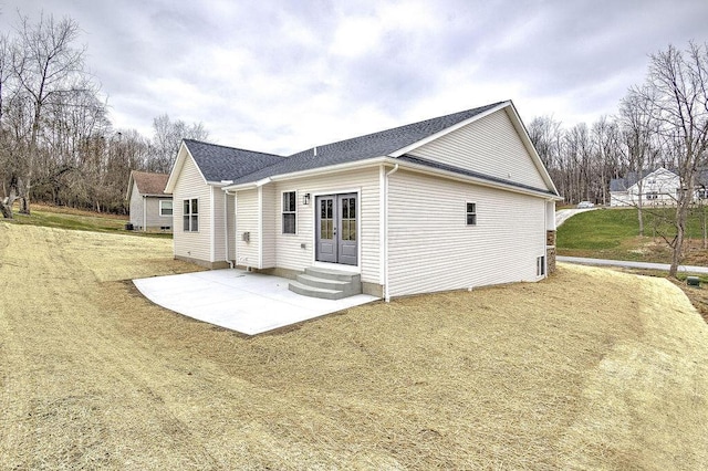 back of house with french doors, a yard, and a patio area