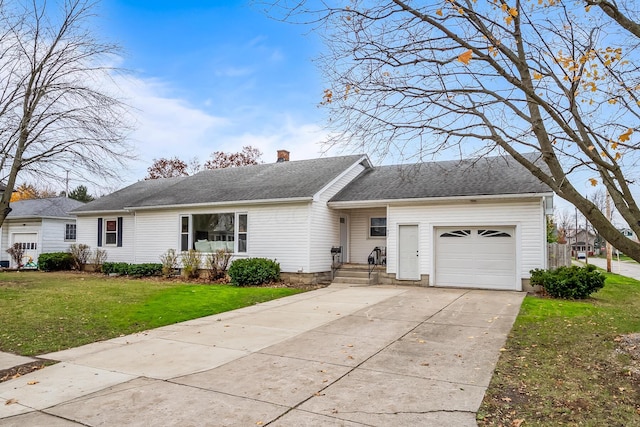 ranch-style house with a garage and a front lawn