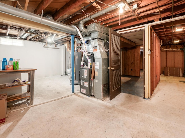 basement with gas water heater and heating unit