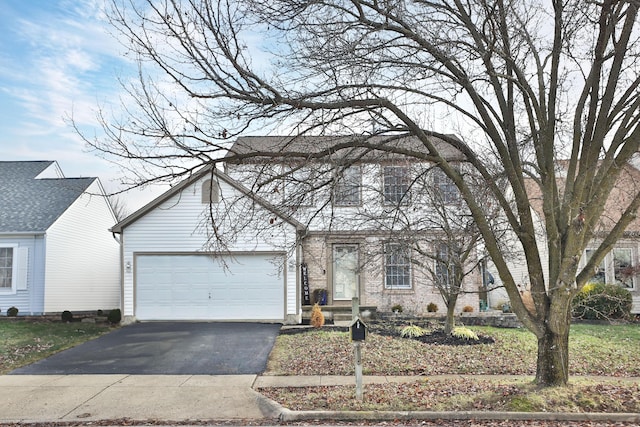 view of front of property with a garage