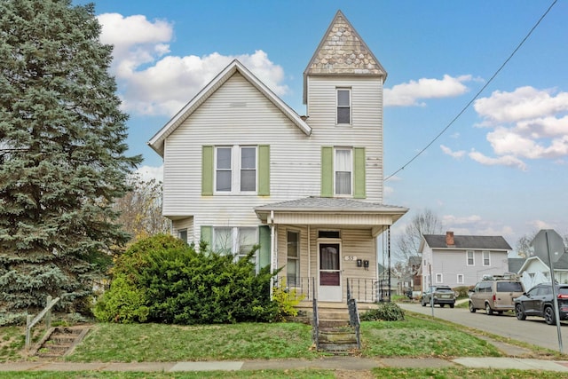 view of front of home featuring covered porch and a front yard