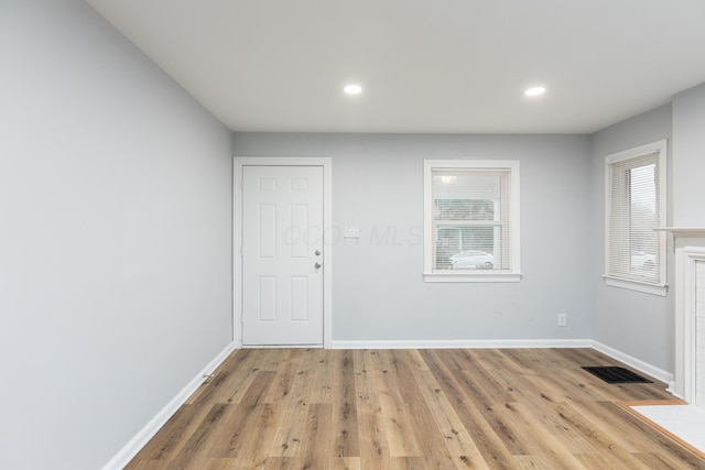 spare room with light hardwood / wood-style floors