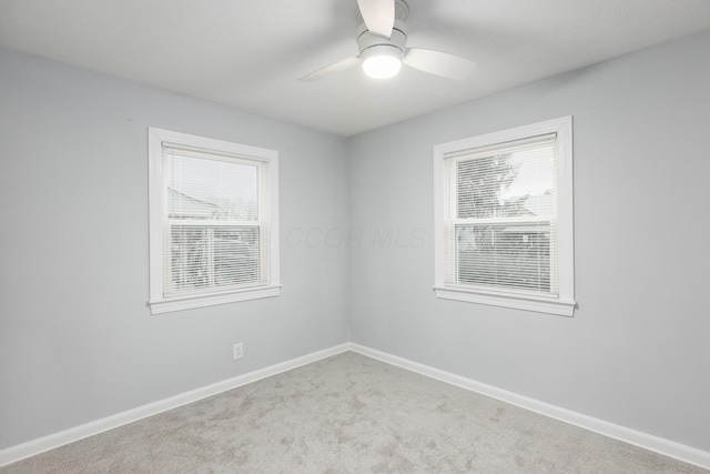 carpeted empty room with ceiling fan