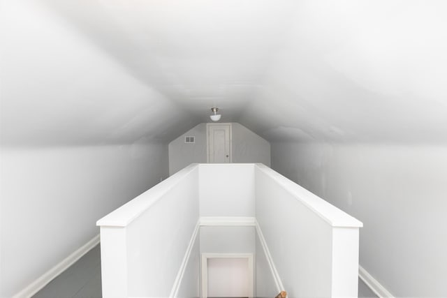 stairs featuring lofted ceiling