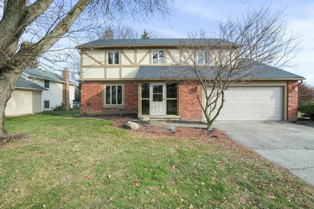 view of front of property with a front yard and a garage