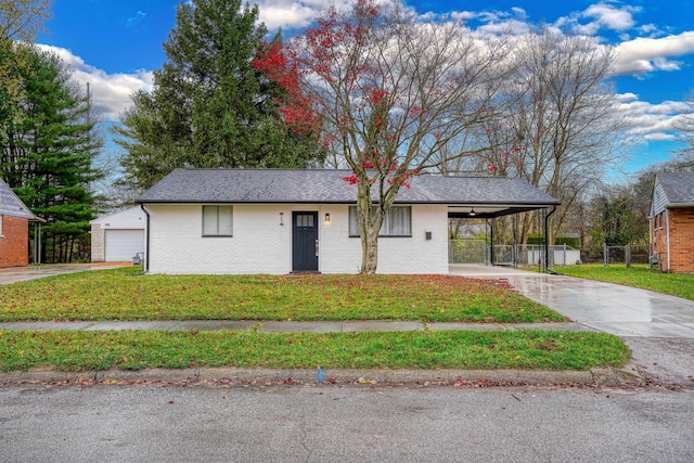 view of front of property featuring a carport and a front lawn