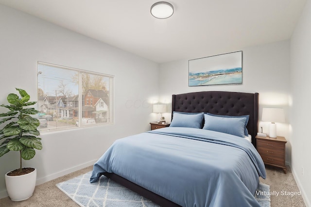 bedroom featuring light colored carpet