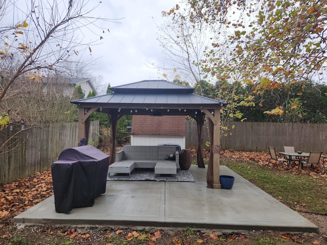 view of patio with a gazebo, an outdoor living space, and area for grilling