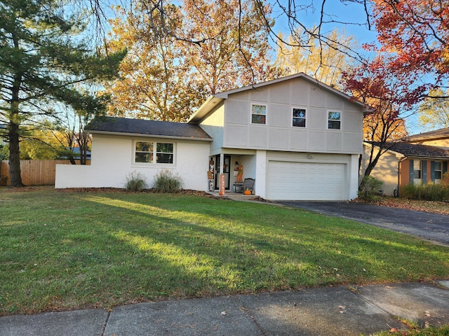 tri-level home with a front lawn and a garage