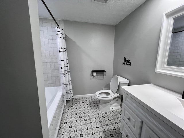 full bathroom with shower / tub combo with curtain, vanity, a textured ceiling, and toilet