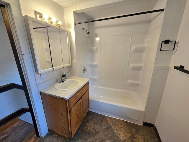 bathroom featuring washtub / shower combination, wood-type flooring, and vanity