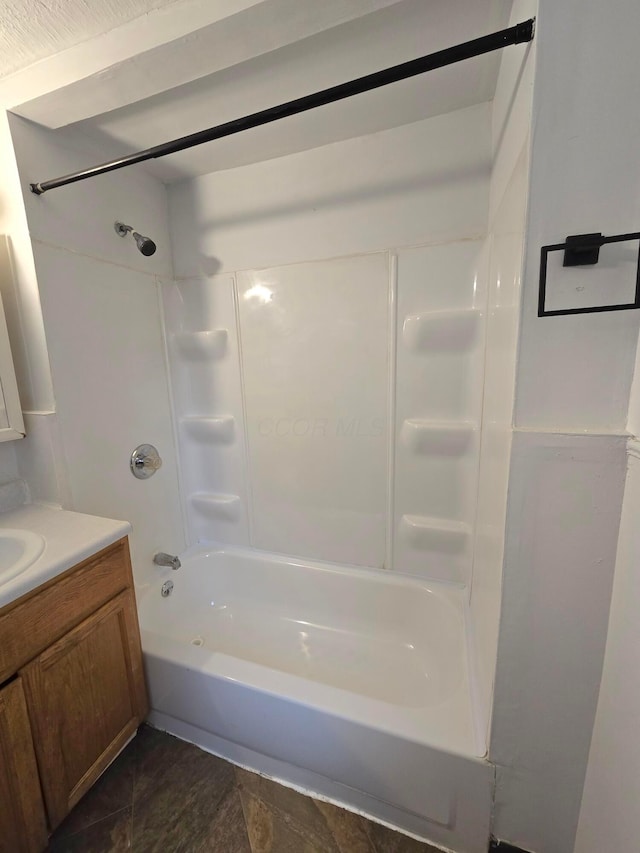 bathroom with vanity and bathtub / shower combination