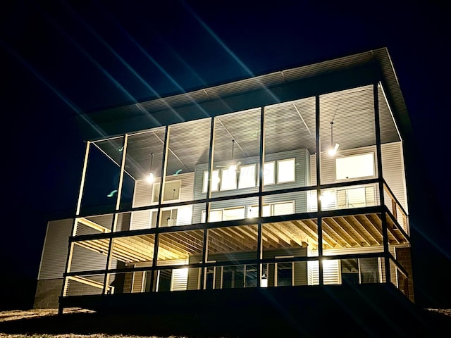 view of back house at night