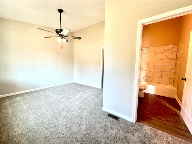 spare room with wood-type flooring, a textured ceiling, and ceiling fan