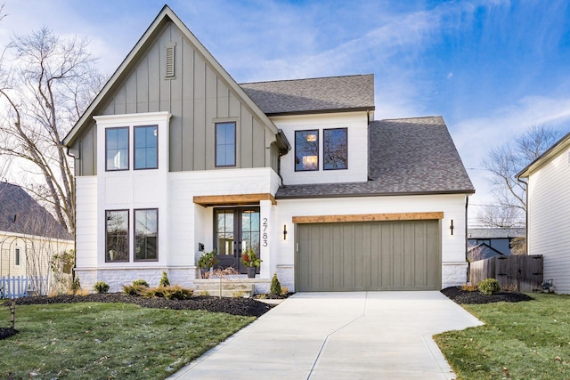 view of front facade with a garage and a front yard