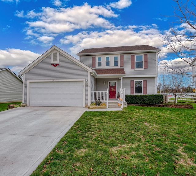 front of property featuring a front yard and a garage