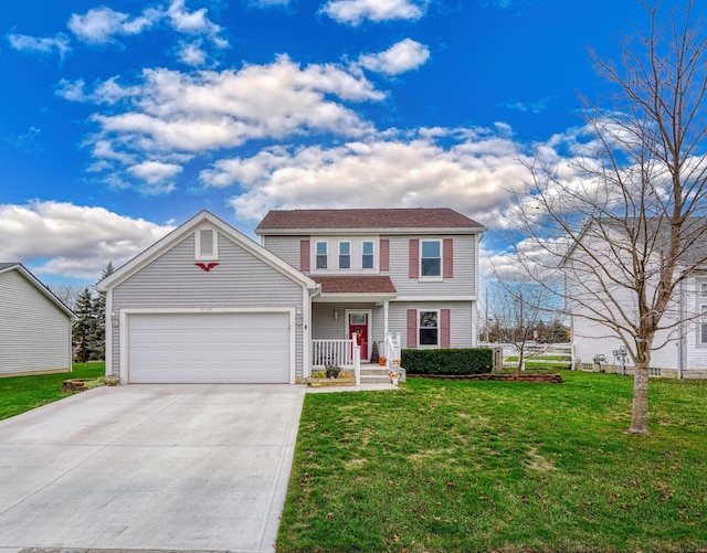 view of front of property with a front yard and a garage