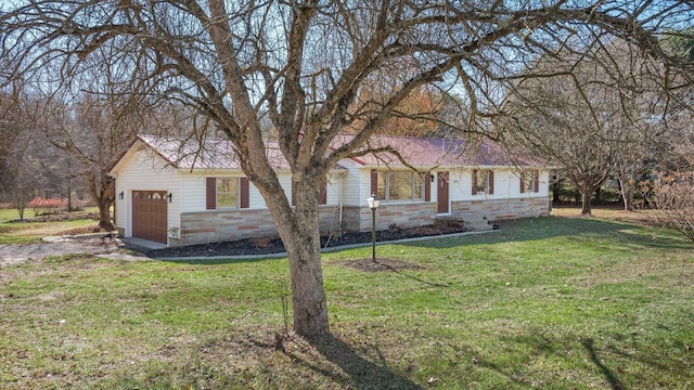 single story home with a front yard and a garage