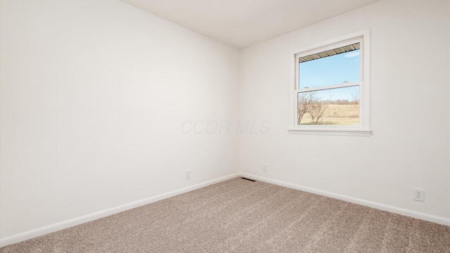 empty room featuring carpet flooring