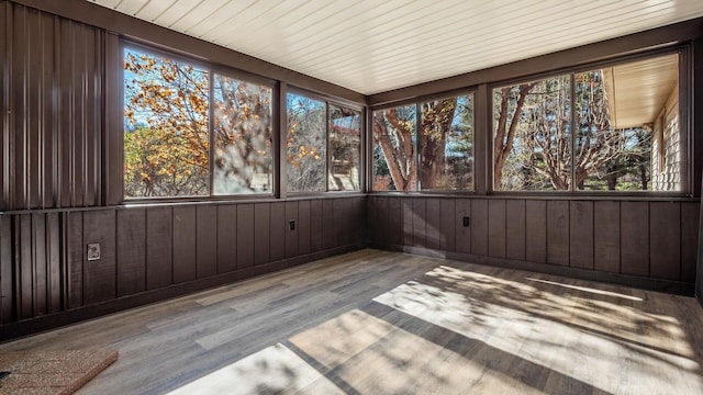 unfurnished sunroom featuring plenty of natural light