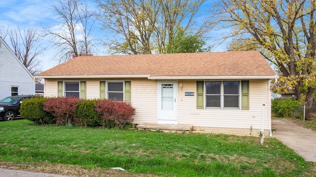 view of front of property with a front lawn