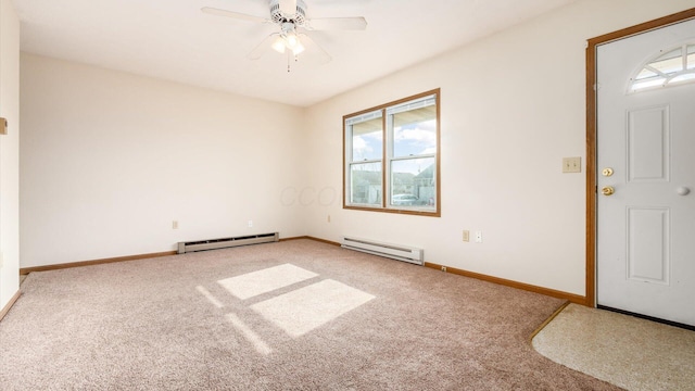 foyer with baseboard heating, ceiling fan, and carpet