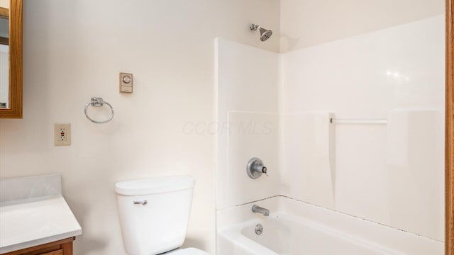 full bathroom with toilet, vanity, and washtub / shower combination