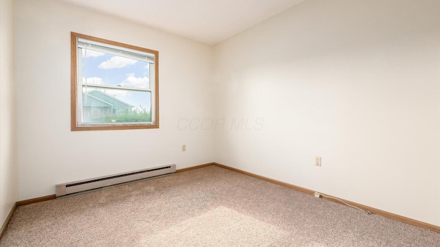 unfurnished room with carpet flooring and a baseboard heating unit