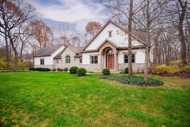 view of front of home with a front lawn