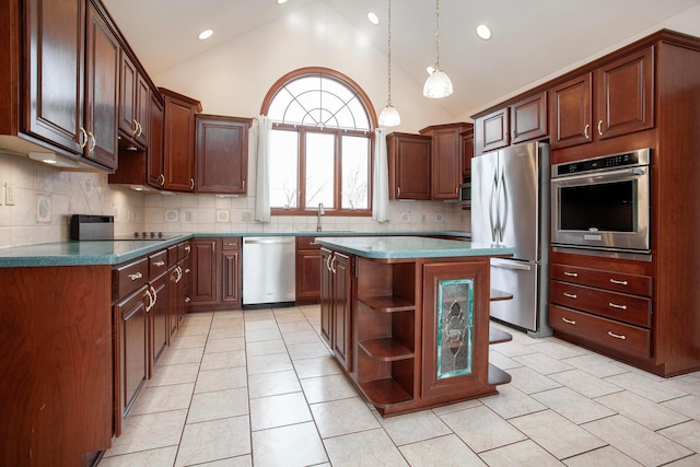 kitchen featuring decorative backsplash, a center island, sink, and appliances with stainless steel finishes