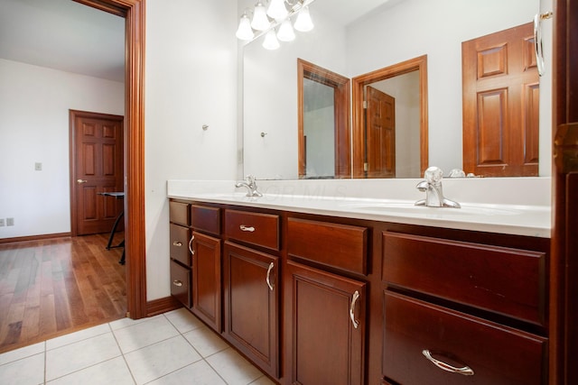 bathroom featuring hardwood / wood-style flooring and vanity