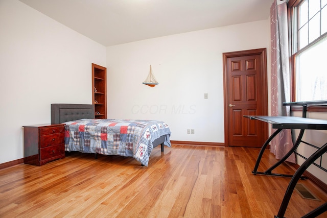 bedroom with light hardwood / wood-style floors