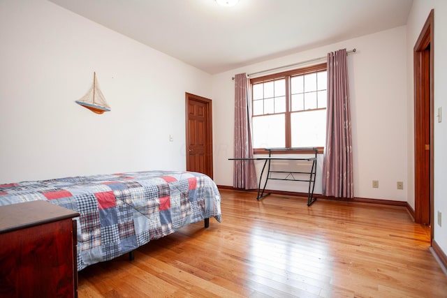 bedroom with light wood-type flooring