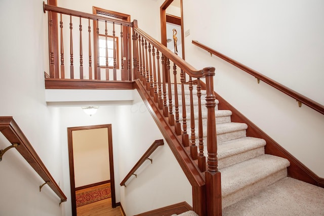 stairs with wood-type flooring