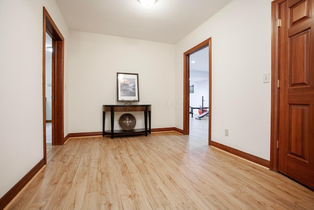 hall with light hardwood / wood-style floors