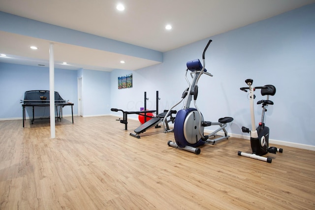 exercise area featuring light hardwood / wood-style flooring