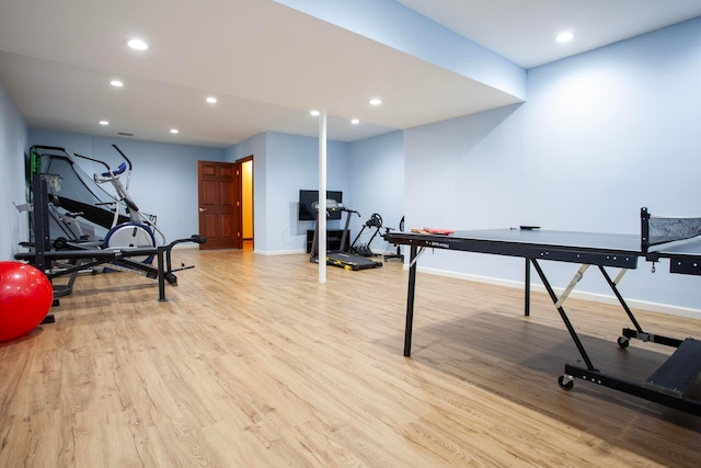 exercise room featuring light hardwood / wood-style flooring