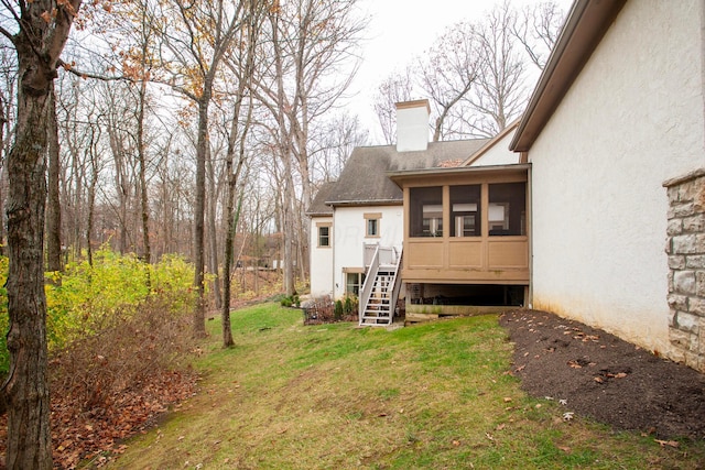 view of yard featuring a sunroom