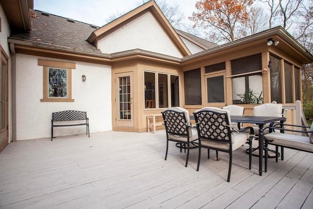 wooden terrace with a sunroom