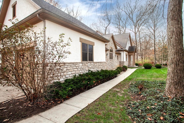 view of home's exterior featuring a yard