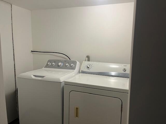 laundry area featuring washing machine and clothes dryer